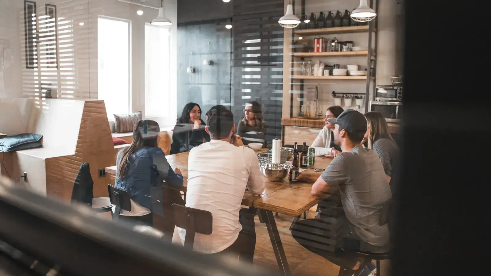 Colleagues in conversation around a table